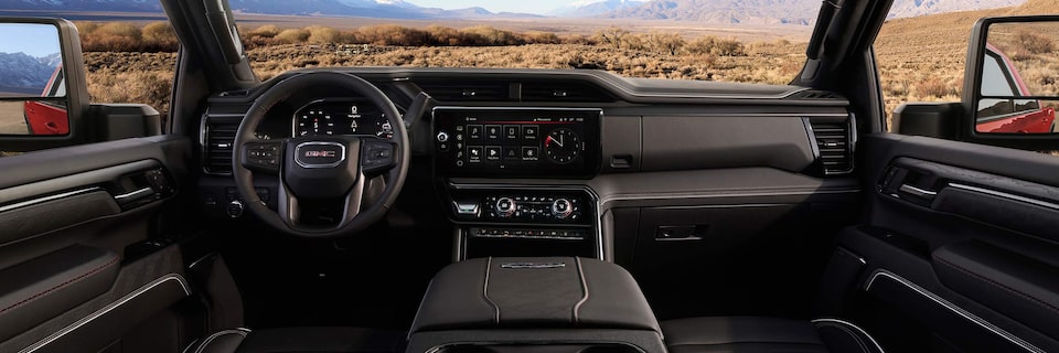 Interior View of the Steering Wheel and Dashboard of the Sierra HD AT4X AEV