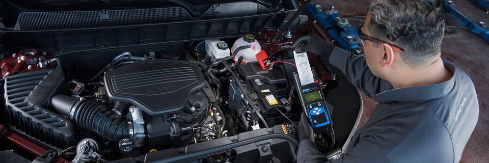 Certified GMC technician checking battery health