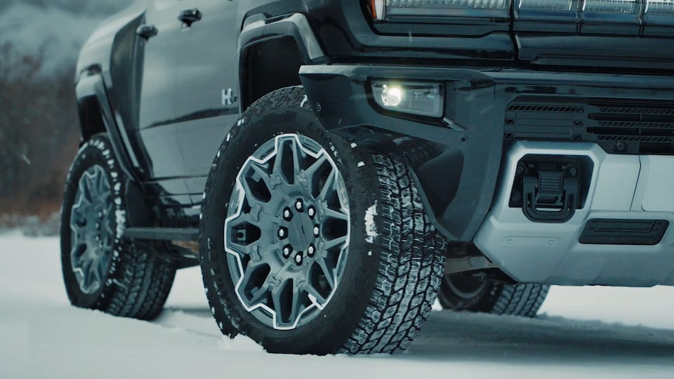 Close-up of the GMC HUMMER EV Pickup Truck Tires with CrabWalk Driving Technology in Use