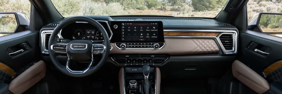 Close-Up View of the Interior Dashboard and Infotainment System in a GMC Denali Vehicle