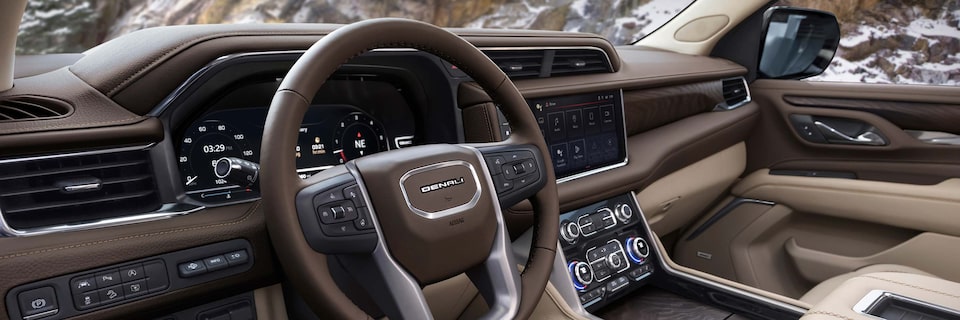 Close-up View of the Steering Wheel, Digital Cockpit and Infotainment System in a GMC Denali Vehicle