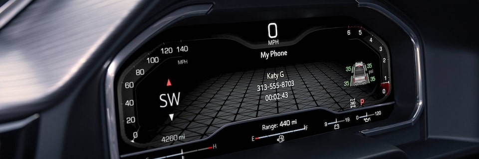 Close-up View of the Digital Cockpit in a GMC Denali Vehicle Showing Hands-Free Calling Application In Use