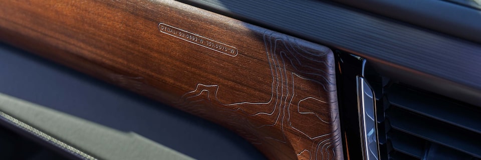 Close-up View of Wood Paneling on the Dashboard in a GMC Denali Vehicle