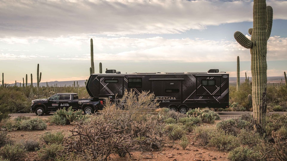 GMC Sierra 3500 HD Denali towing a customized RV