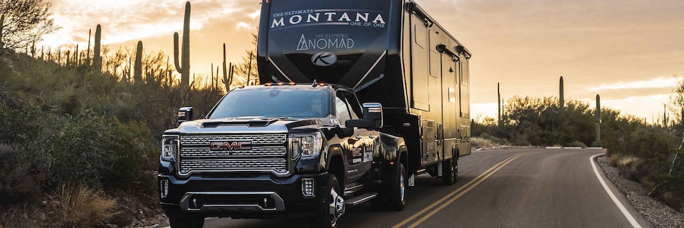 GMC Sierra Truck Trailering Camper in Desert