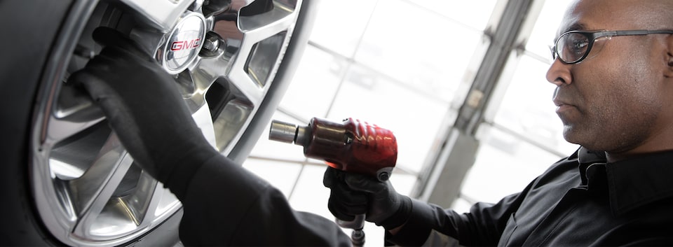 Image of a technician at a GMC Business Elite Dealer.