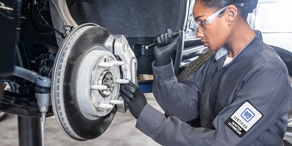 GMC Certified Service Technician Installing Brake Rotor on a Vehicle