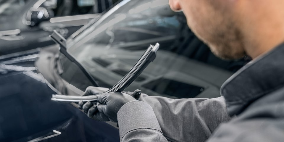 GMC Certified Service Technician Inspecting a Windshield Wiper