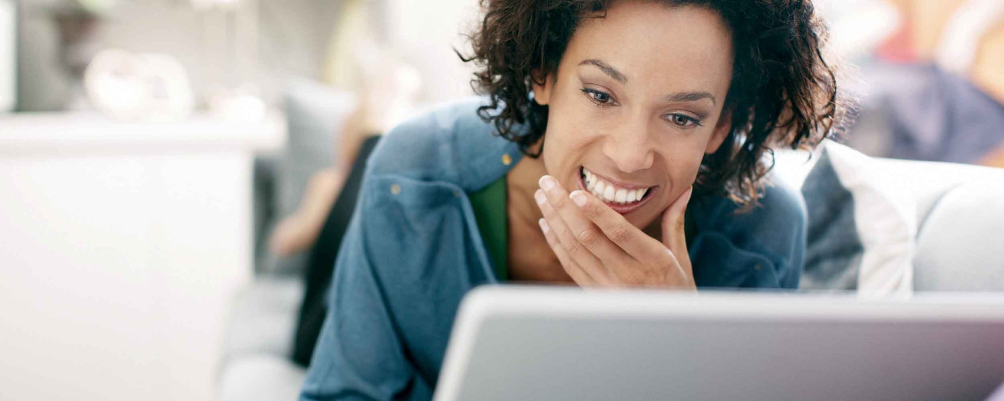 Woman using laptop to create a deal with Shop Click Drive