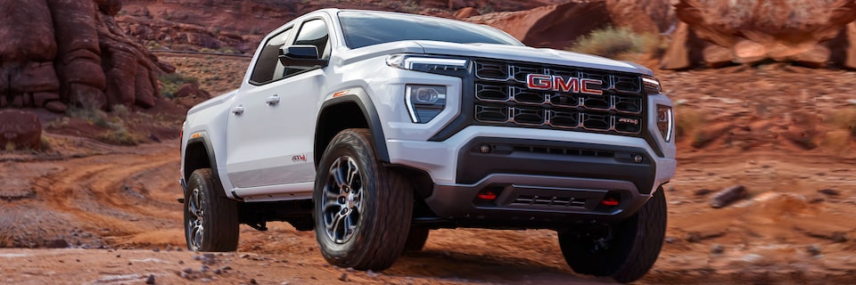 Close-up of a GMC Canyon AT4 Truck Driving Through the Desert