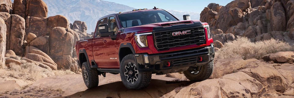 Close-up of a GMC Sierra HD AT4 Truck Driving Through the Desert