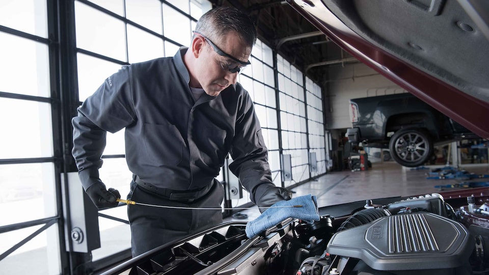 2021 GMC Commercial Vehicles: Mechanic Inspecting Wheels