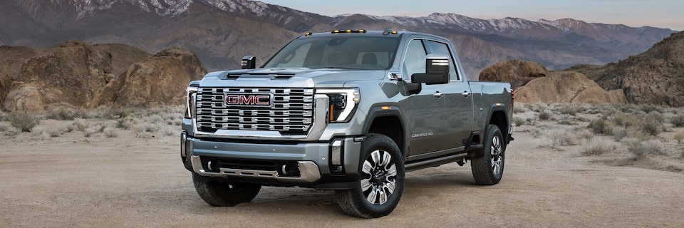 Wide Front Three-Quarters View of a GMC Sierra HD Denali Truck Parked in the Desert