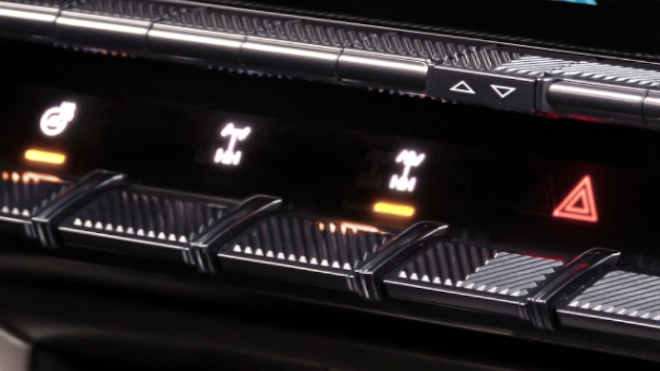 Close-up of the Control Buttons of the GMC Hummer EV SUV Front Control Panel