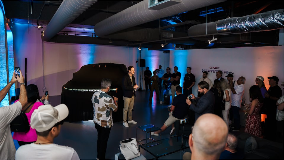 A Packed GMC Showroom Full of People