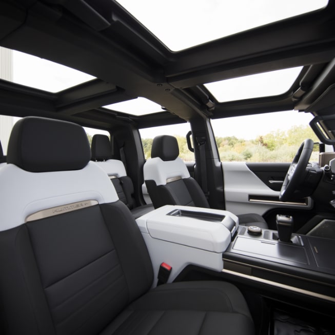 A Passengers View of the open Moonroof and Interior of the GMC HUMMER EV Pickup