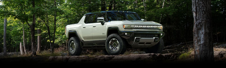 The Imposing Hummer EV Off-Roading on a Woodland Trail