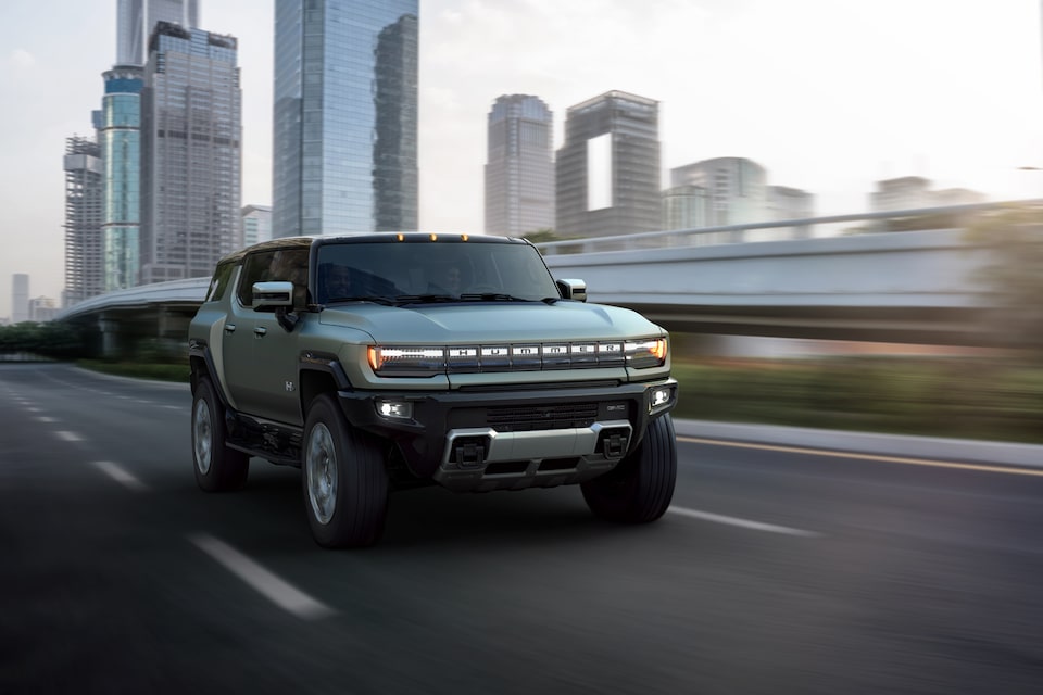 The Hummer EV Speeding on an Open Expressway in the City