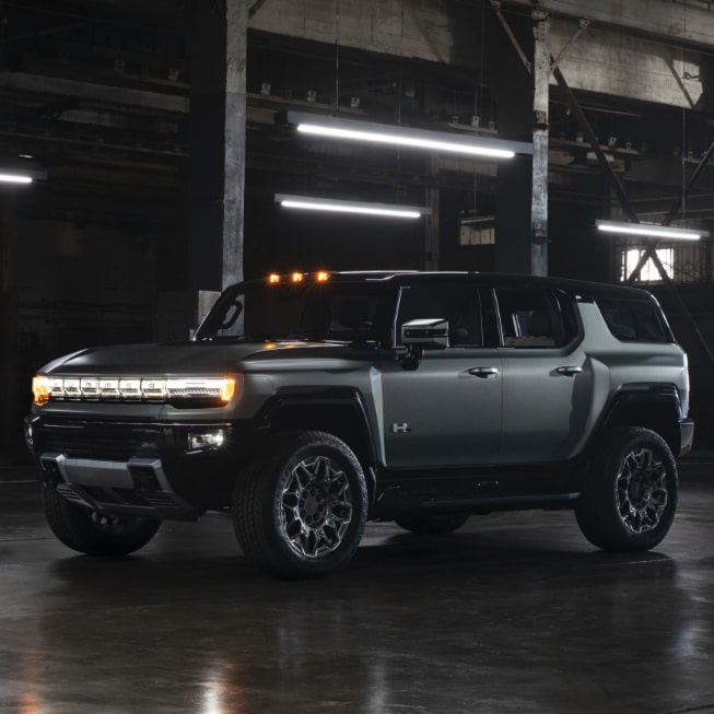 The GMC HUMMER EV SUV Parked On-Road in a Warehouse