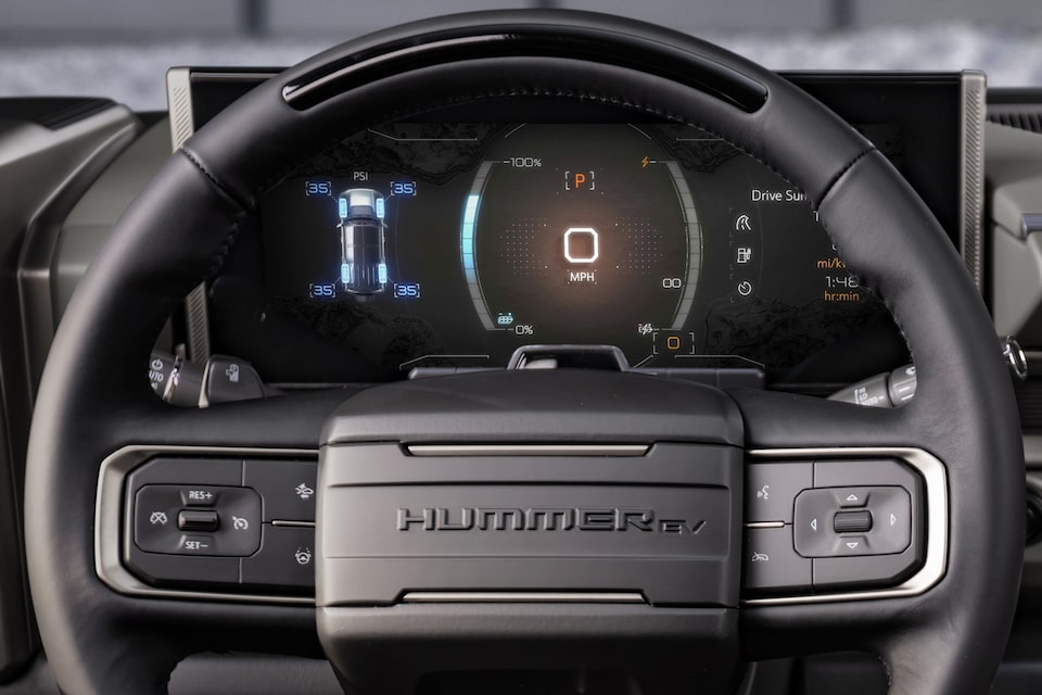 Close-up of the Steering Wheel and the Dashboard Displaying Regen on Demand in the GMC HUMMER EV SUV 