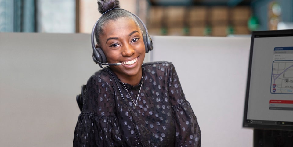 A Smiling Woman Working at a Call Center