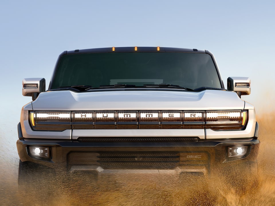 A Hummer EV Driving in a Desert