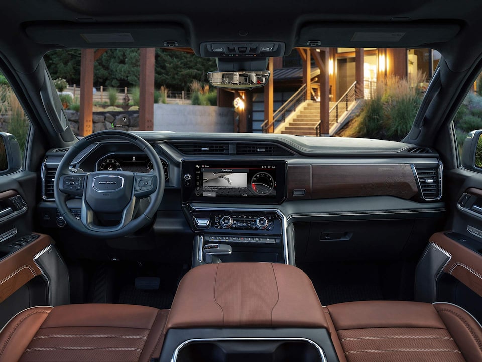 Interior View of a GMC Vehicle Showing the Steering Wheel, Digital Cockpit and Infotainment System