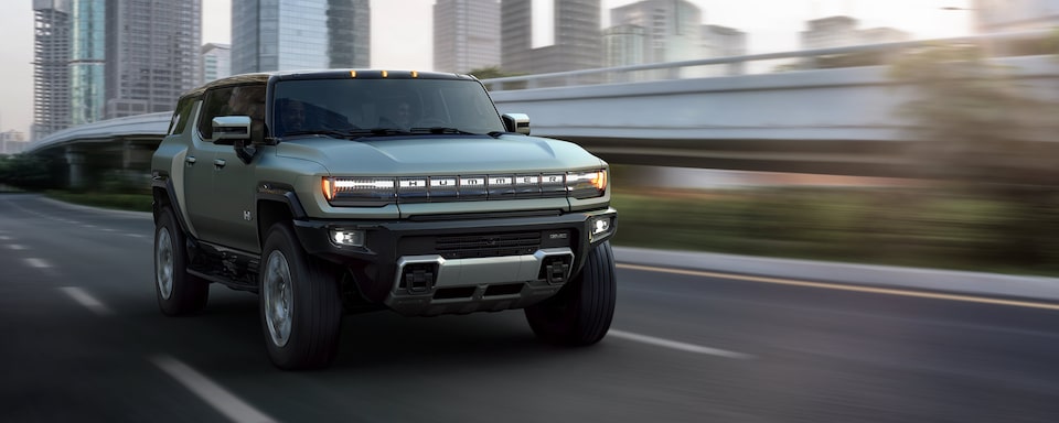 A GMC HUMMER EV SUV Driving Down the Highway