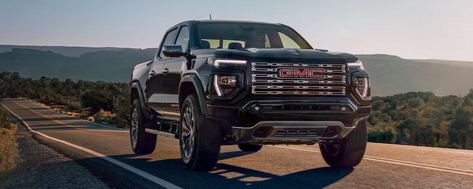 The Front of the 2024 GMC Canyon Denali Driving On-Road