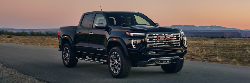 A Black GMC Canyon Denali Driving On-Road