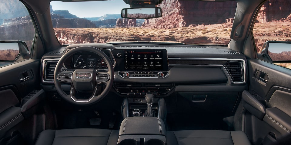 The GMC Canyon Elevation Front Interior with the Steering Wheel and Infotainment System