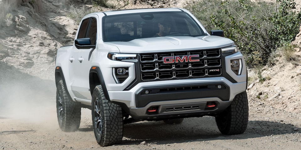 The GMC Canyon AT4 Driving Off-Road Kicking Up Dirt