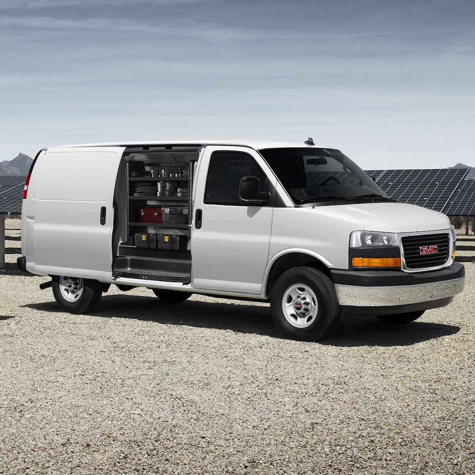 A Side Profile Shot of the GMC Savana Cargo Van with the Cargo Door Open