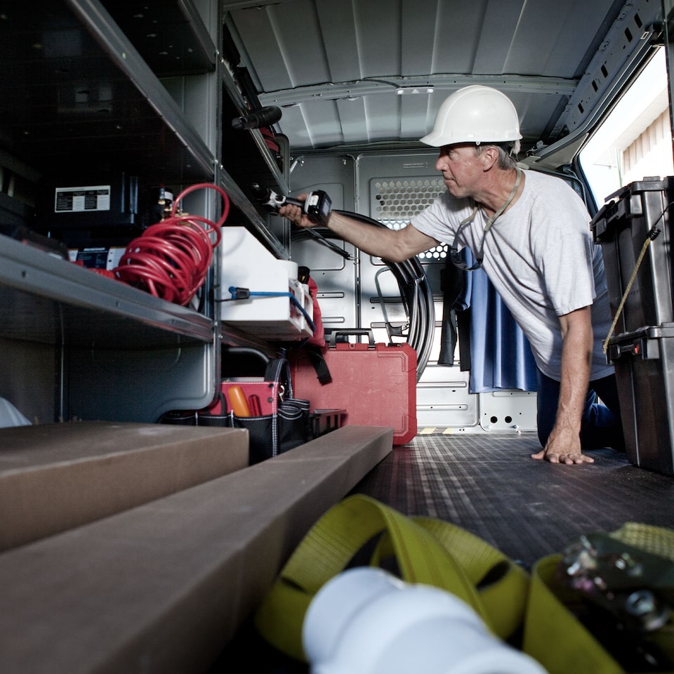 A Worker in the Inside of the GMC Savana Cargo Van