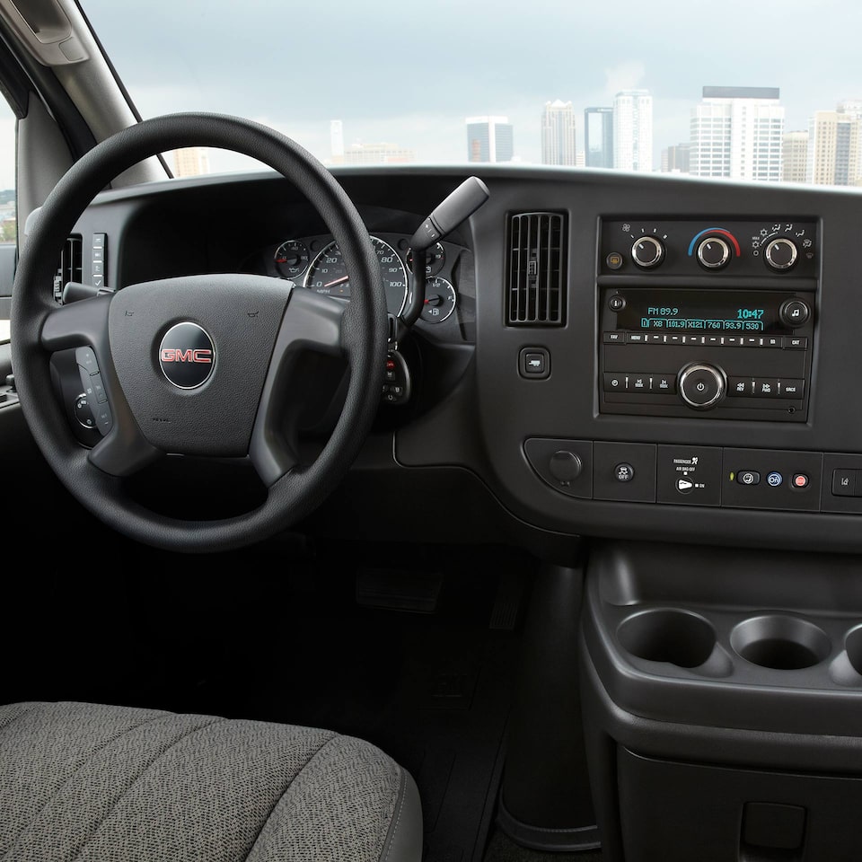 A Driver's View of the Front Interior of the GMC Savana Cargo Van