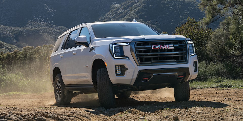 2024 GMC Yukon AT4 Driving up a Dirt Hill