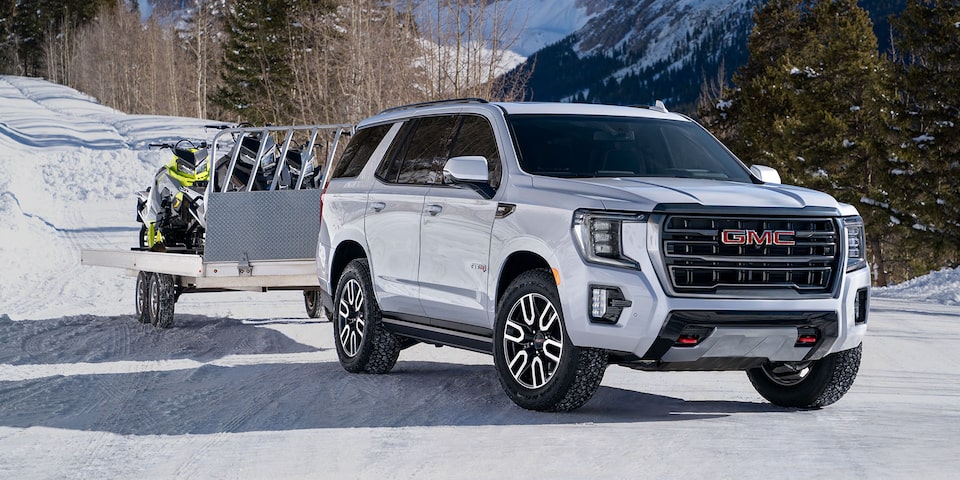 2024 GMC Yukon Towing a Trailer Through the Snow