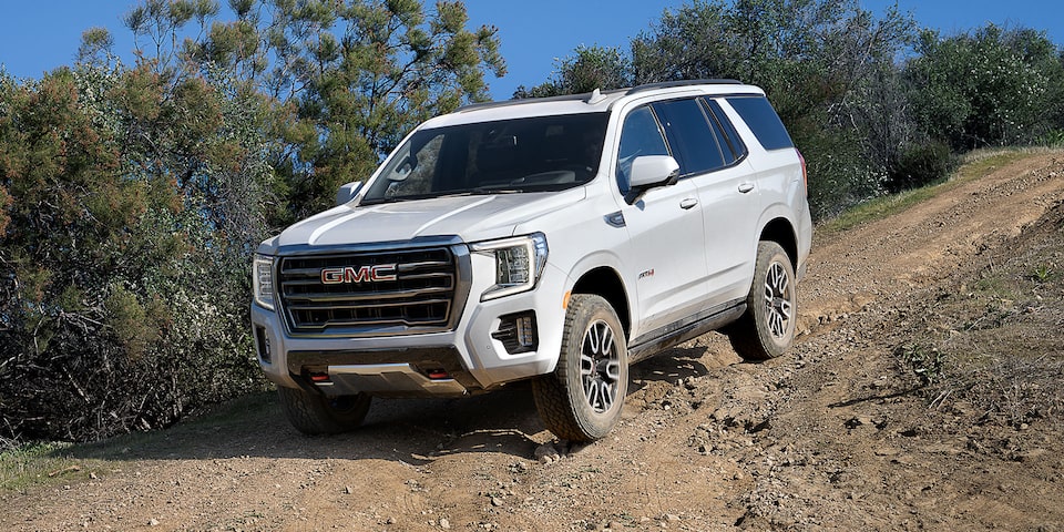 The 2024 GMC Yukon Driving Off-Road Downhill