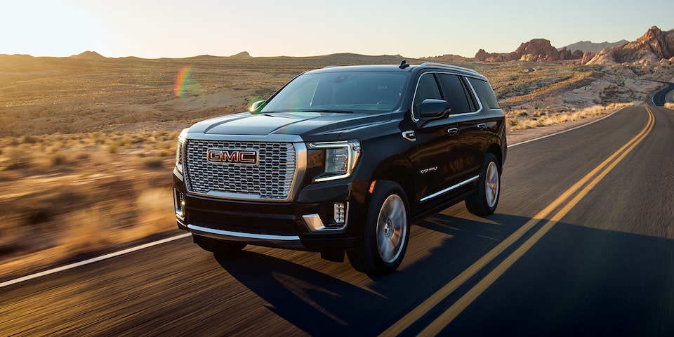 The Black GMC Yukon Denali Driving On-Road