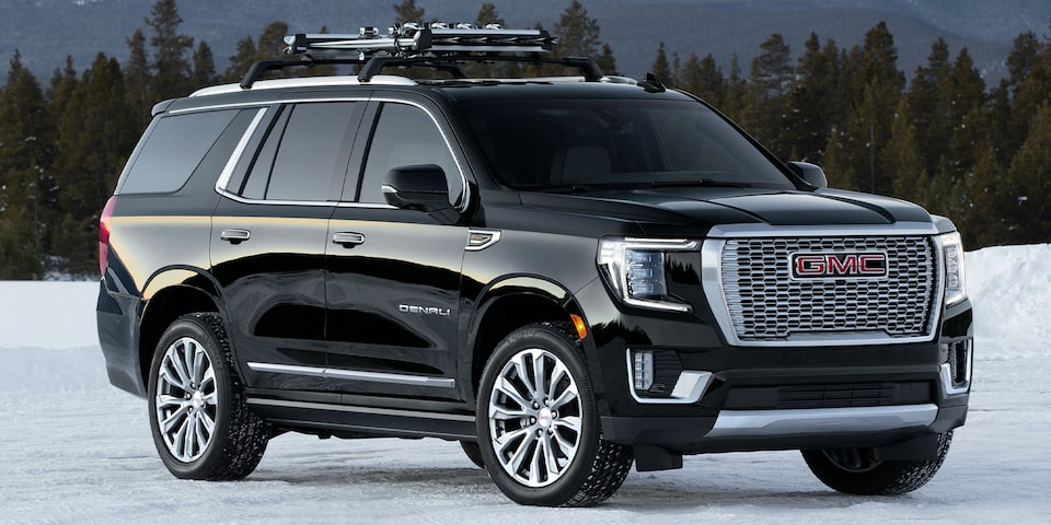 A Black GMC Yukon Denali Parked Off-Road on Snow