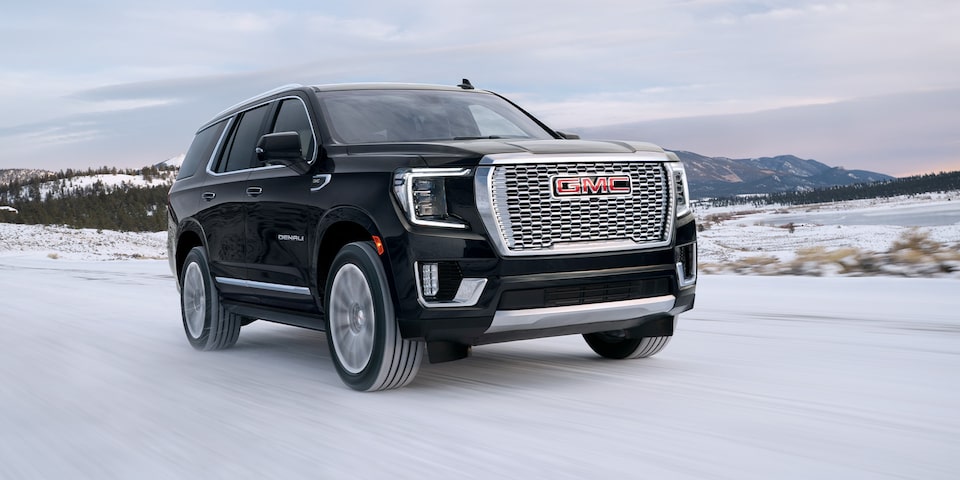 A Black GMC Yukon Denali Driving Off-Road on Snow