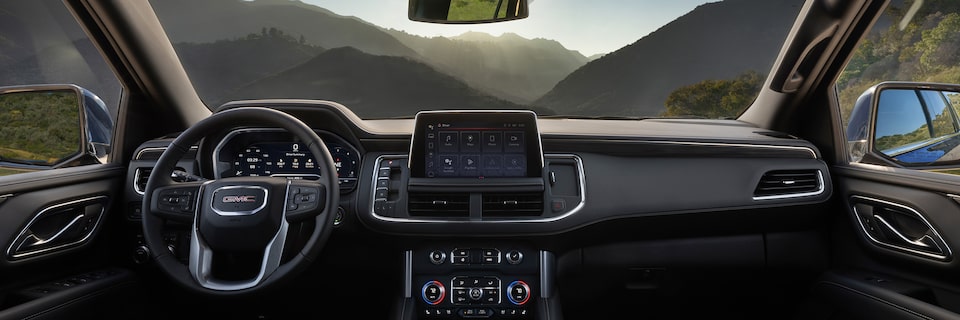 Wide Interior View of the Front Seats and Infotainment System in the 2024 GMC Yukon SUV