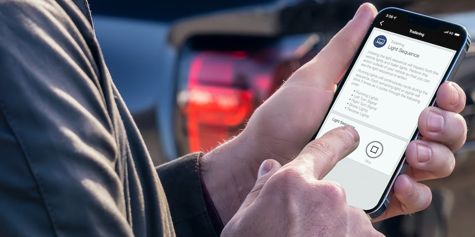 Man Using Trailering Features In The MyGMC App