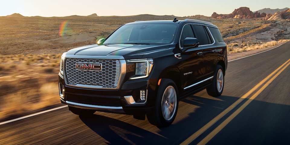 A Driver's Side shot of the GMC Yukon Driving On-Road