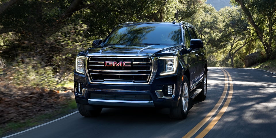 A Shot of a GMC Yukon Driving On-Road