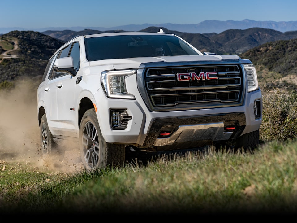 A Lineup of the 2024 GMC Yukon Trims Parked