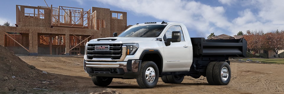 A White GMC Sierra HD Chassis Cab Parked on a Construction Site