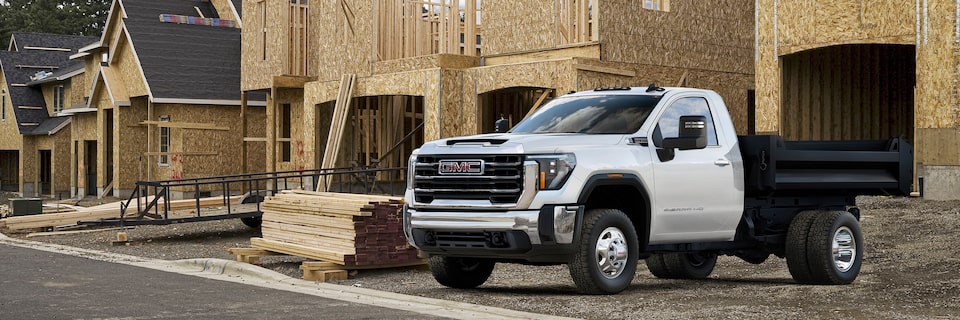 A Parked GMC Sierra HD Chassis Cab Next to a Housing Construction Site