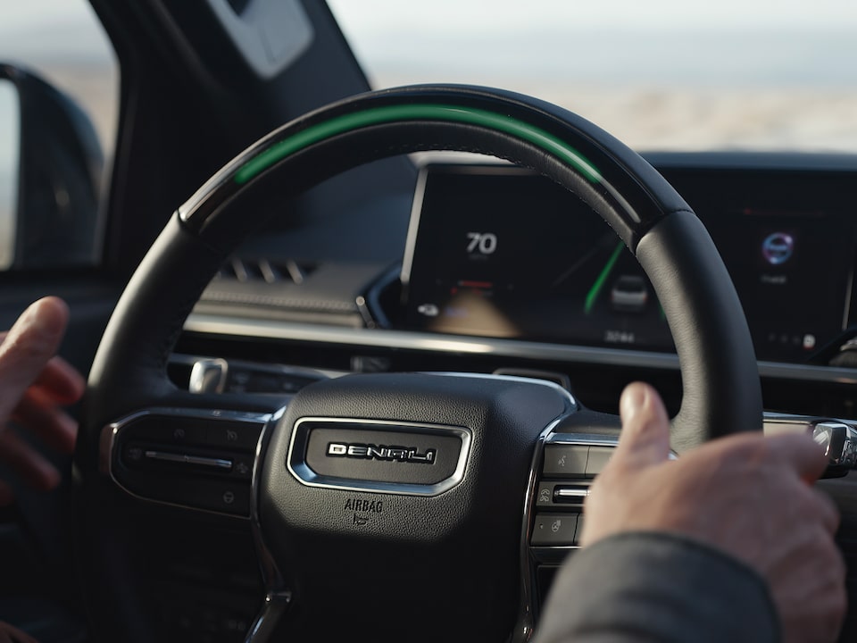 Close-up View of a Driver Using the SuperCruise Feature in the GMC Sierra EV