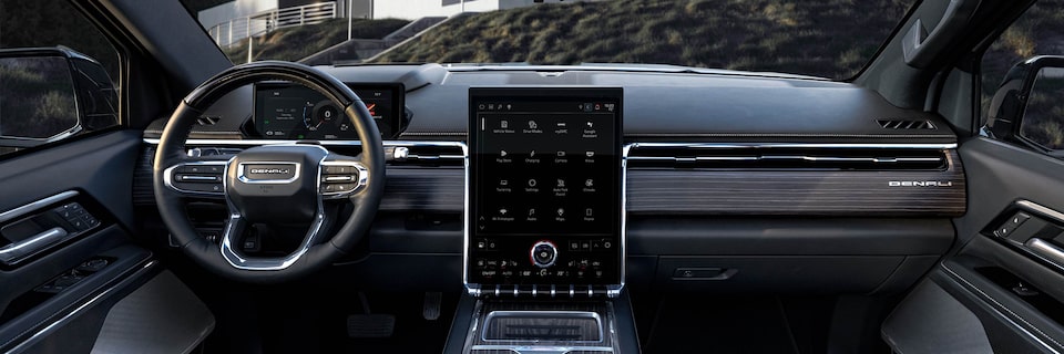 Interior View of the Steering Wheel, Infotainment System, and Dashboard of the Sierra EV Denali